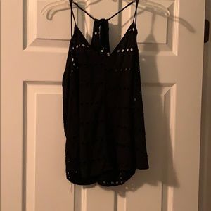 Black tank with holes and flower pattern